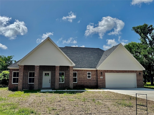 58 Lantana Ct, Lake Jackson, TX 77566 - view of front of home with a garage, brick siding, and concrete driveway