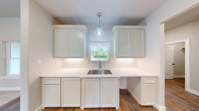 58 Lantana Ct, Lake Jackson, TX 77566 - kitchen featuring white cabinetry, decorative backsplash, pendant lighting, and dark wood-style floors