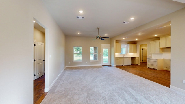 58 Lantana Ct, Lake Jackson, TX 77566 - unfurnished living room with ceiling fan, carpet flooring, recessed lighting, and wood finished floors