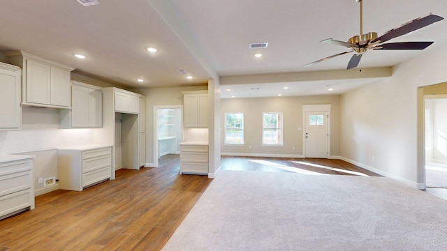 58 Lantana Ct, Lake Jackson, TX 77566 - kitchen featuring ceiling fan, light wood-type flooring, recessed lighting, and white cabinetry