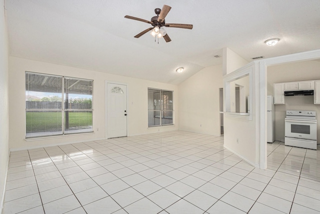 2612 Jeb Stuart Dr, League City, TX 77573 - unfurnished living room with vaulted ceiling, light tile patterned floors, and ceiling fan