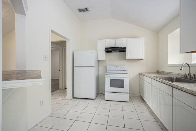 2612 Jeb Stuart Dr, League City, TX 77573 - kitchen with white appliances, under cabinet range hood, vaulted ceiling, white cabinets, and light tile patterned floors
