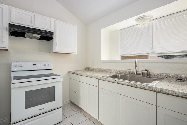 2612 Jeb Stuart Dr, League City, TX 77573 - kitchen with electric range, under cabinet range hood, lofted ceiling, light countertops, and white cabinets
