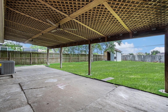 2612 Jeb Stuart Dr, League City, TX 77573 - fenced backyard with a patio area, a storage unit, and ceiling fan