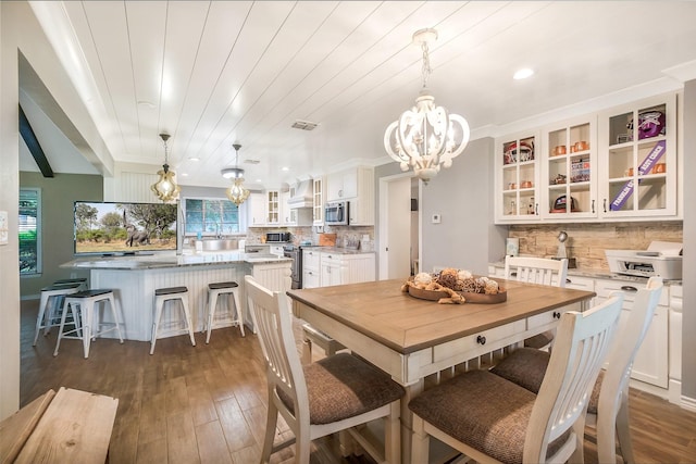 36602 Hondo Rd, Simonton, TX 77485 - dining space with a chandelier, dark wood finished floors, and recessed lighting