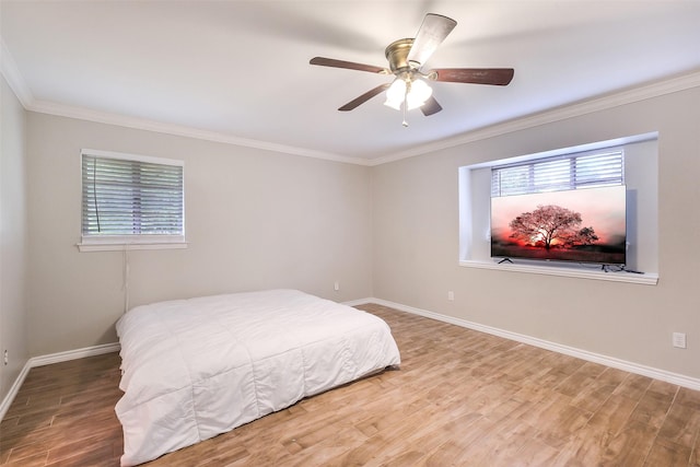 36602 Hondo Rd, Simonton, TX 77485 - bedroom featuring crown molding, wood finished floors, and a ceiling fan
