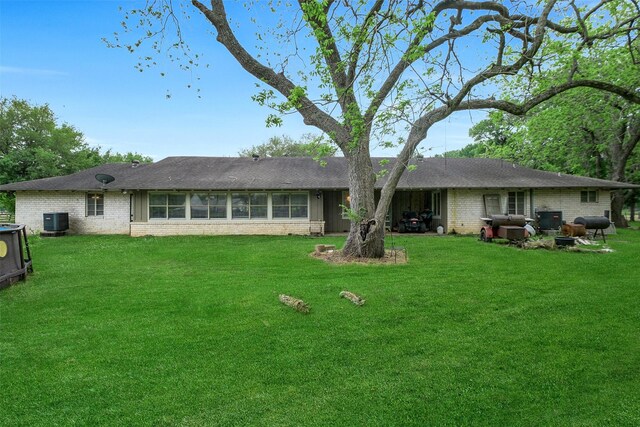 36602 Hondo Rd, Simonton, TX 77485 - rear view of house with brick siding and a lawn