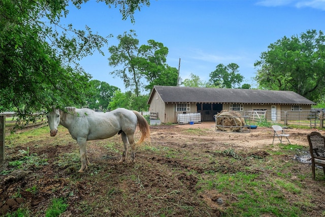 36602 Hondo Rd, Simonton, TX 77485 - rear view of house with an exterior structure and an outdoor structure