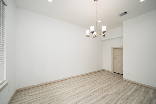29423 Red Rocks Park Dr, Katy, TX 77494 - unfurnished room featuring wood finished floors, a chandelier, and recessed lighting