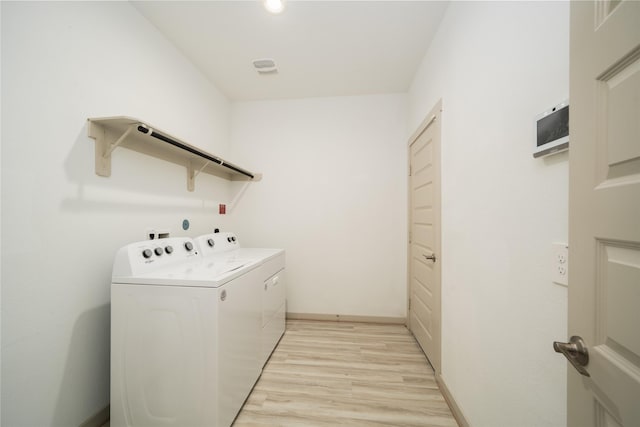29423 Red Rocks Park Dr, Katy, TX 77494 - laundry room with washing machine and clothes dryer and light wood-style floors
