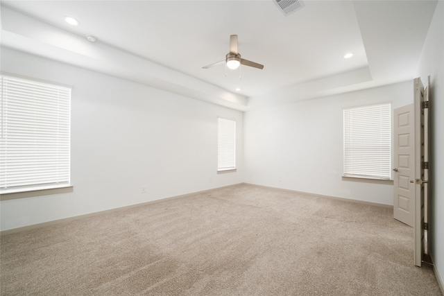 29423 Red Rocks Park Dr, Katy, TX 77494 - carpeted empty room featuring a ceiling fan, a raised ceiling, and recessed lighting