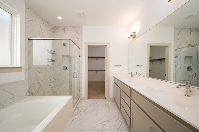 29423 Red Rocks Park Dr, Katy, TX 77494 - bathroom with marble finish floors, a walk in closet, a bath, a marble finish shower, and recessed lighting
