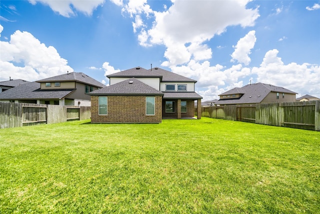 29423 Red Rocks Park Dr, Katy, TX 77494 - rear view of property with a fenced backyard, brick siding, and a shingled roof