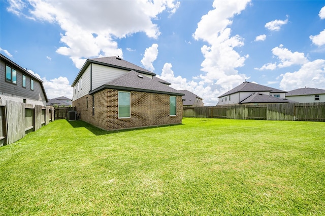 29423 Red Rocks Park Dr, Katy, TX 77494 - rear view of property featuring brick siding, a fenced backyard, and a shingled roof