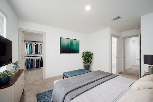 29423 Red Rocks Park Dr, Katy, TX 77494 - bedroom with light carpet, a closet, and a walk in closet