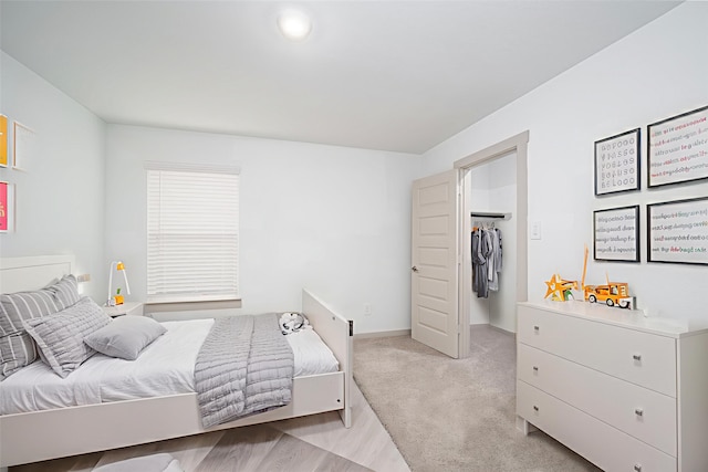 29423 Red Rocks Park Dr, Katy, TX 77494 - bedroom featuring a spacious closet and light colored carpet