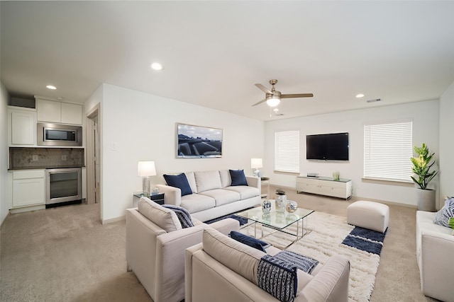 29423 Red Rocks Park Dr, Katy, TX 77494 - living room featuring light colored carpet, a ceiling fan, wine cooler, and recessed lighting