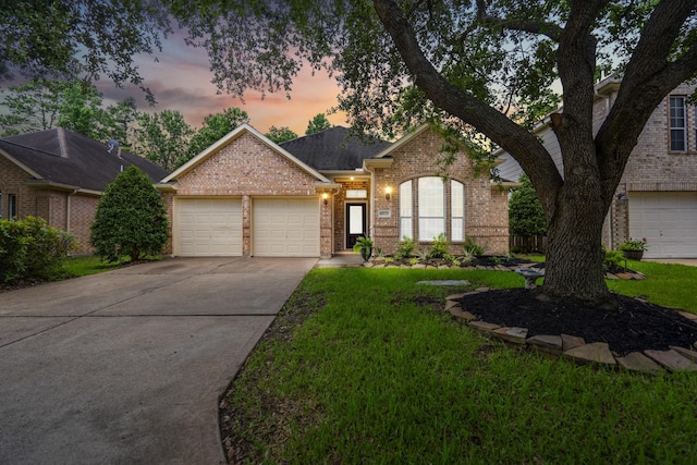 16115 Woodbend Trail Dr, Houston, TX 77070 - view of front of house with brick siding, an attached garage, driveway, a front yard, and roof with shingles