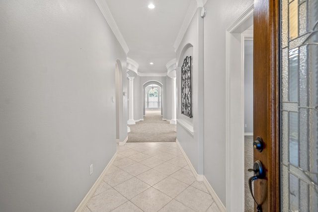 16115 Woodbend Trail Dr, Houston, TX 77070 - hall with arched walkways, decorative columns, ornamental molding, light tile patterned floors, and light colored carpet
