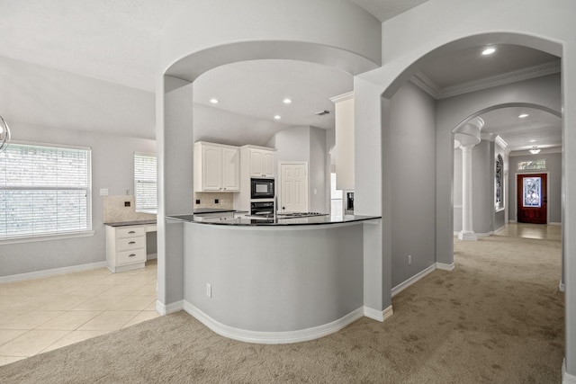16115 Woodbend Trail Dr, Houston, TX 77070 - kitchen featuring black appliances, dark countertops, light colored carpet, crown molding, and arched walkways