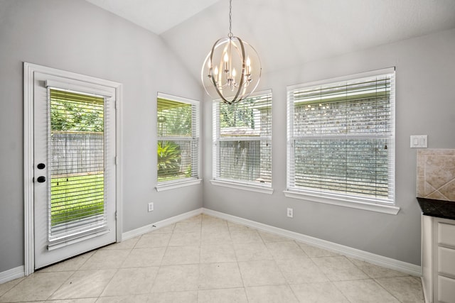16115 Woodbend Trail Dr, Houston, TX 77070 - unfurnished dining area featuring a chandelier, lofted ceiling, and light tile patterned floors