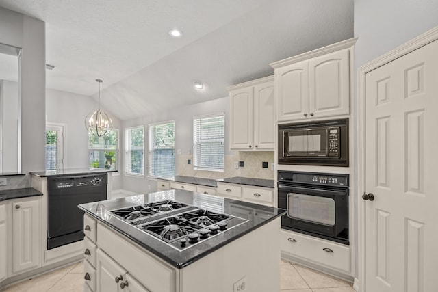 16115 Woodbend Trail Dr, Houston, TX 77070 - kitchen featuring black appliances, light tile patterned flooring, vaulted ceiling, tasteful backsplash, and dark countertops