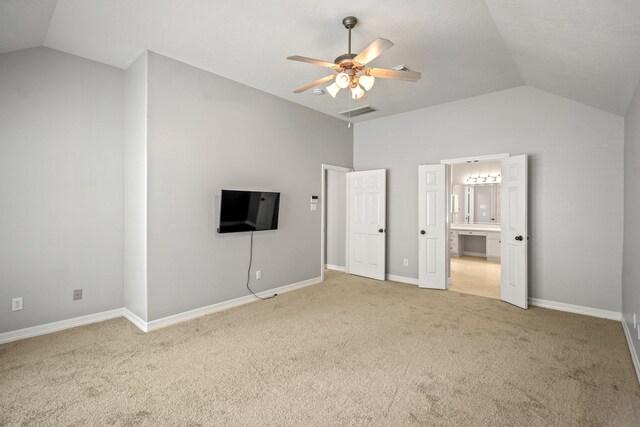 16115 Woodbend Trail Dr, Houston, TX 77070 - unfurnished bedroom with vaulted ceiling, light colored carpet, ensuite bathroom, and ceiling fan