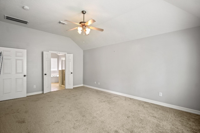 16115 Woodbend Trail Dr, Houston, TX 77070 - unfurnished bedroom with lofted ceiling, light carpet, ensuite bath, and ceiling fan