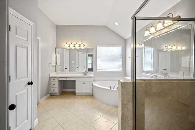 16115 Woodbend Trail Dr, Houston, TX 77070 - bathroom with a bath, vanity, vaulted ceiling, tile patterned floors, and an enclosed shower