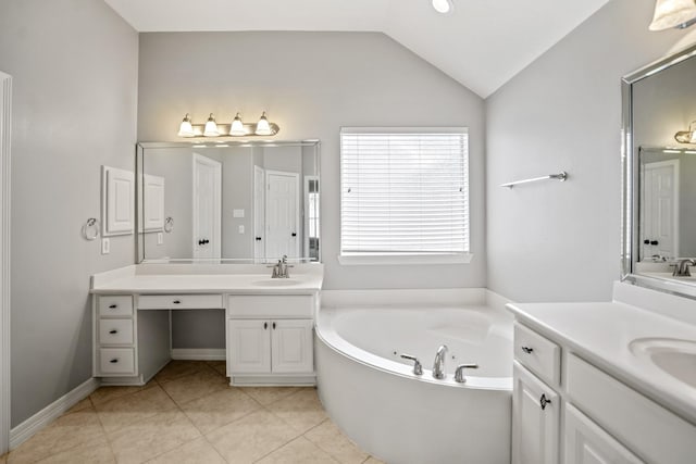 16115 Woodbend Trail Dr, Houston, TX 77070 - bathroom with a tub with jets, two vanities, tile patterned floors, and lofted ceiling