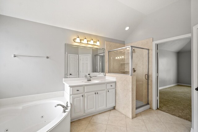 16115 Woodbend Trail Dr, Houston, TX 77070 - bathroom featuring lofted ceiling, a stall shower, vanity, a tub with jets, and tile patterned flooring