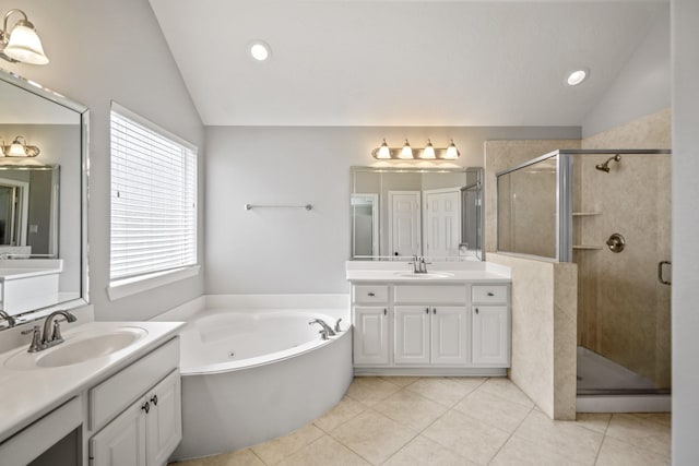16115 Woodbend Trail Dr, Houston, TX 77070 - full bath featuring vaulted ceiling, two vanities, a shower stall, a jetted tub, and tile patterned flooring
