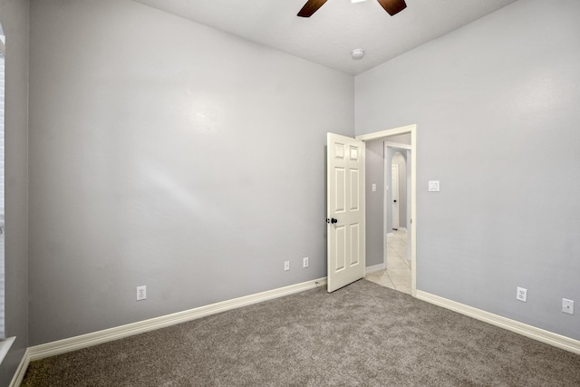 16115 Woodbend Trail Dr, Houston, TX 77070 - spare room with ceiling fan, carpet, arched walkways, a smoke detector, and vaulted ceiling