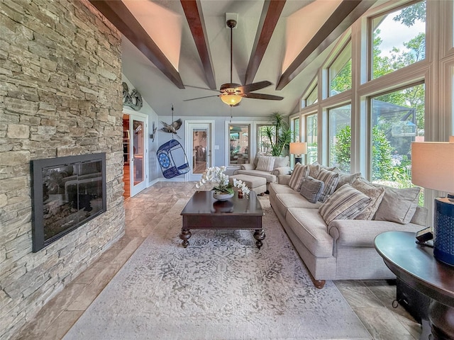 116 Cardinal St, Lake Jackson, TX 77566 - living room featuring beam ceiling, high vaulted ceiling, a ceiling fan, and a fireplace