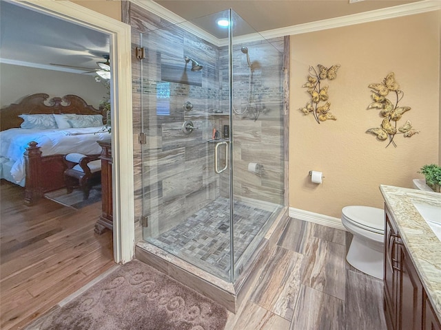 116 Cardinal St, Lake Jackson, TX 77566 - ensuite bathroom with vanity, crown molding, a ceiling fan, a stall shower, and wood finished floors