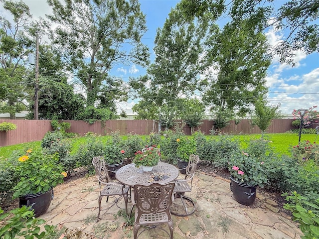 116 Cardinal St, Lake Jackson, TX 77566 - fenced backyard with a patio area and outdoor dining space