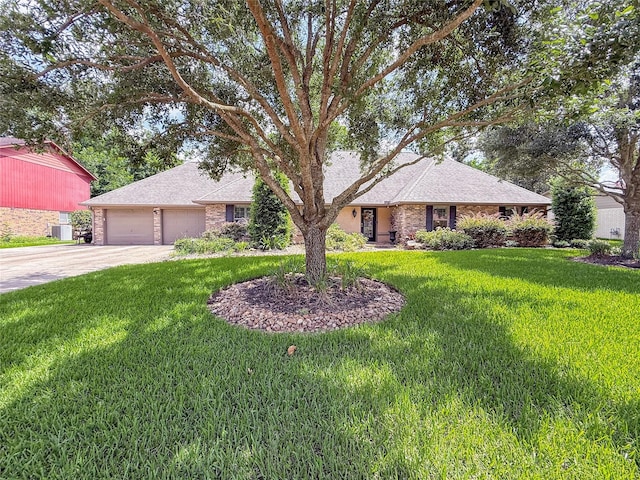 116 Cardinal St, Lake Jackson, TX 77566 - ranch-style house with concrete driveway, an attached garage, a front lawn, and a shingled roof