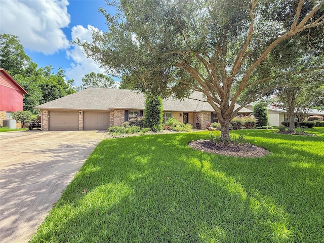 116 Cardinal St, Lake Jackson, TX 77566 - ranch-style home featuring a garage, driveway, a front lawn, roof with shingles, and brick siding