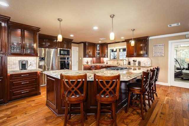 116 Cardinal St, Lake Jackson, TX 77566 - kitchen featuring stainless steel appliances, wood-type flooring, decorative backsplash, crown molding, and glass insert cabinets