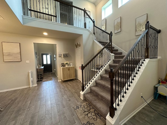 11711 Colossal Oak Dr, Houston, TX 77066 - foyer entrance with plenty of natural light, wood finished floors, stairs, and a towering ceiling