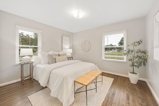 4502 Lido Ln, Houston, TX 77092 - bedroom featuring multiple windows and wood finished floors
