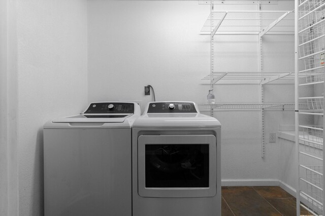 2540 Howell Rd, Corrigan, TX 75939 - laundry room featuring washing machine and dryer and baseboards