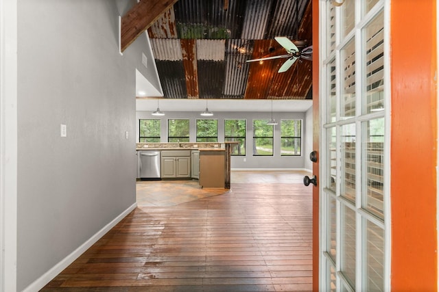 2540 Howell Rd, Corrigan, TX 75939 - hallway featuring plenty of natural light, dark wood-style floors, and a high ceiling