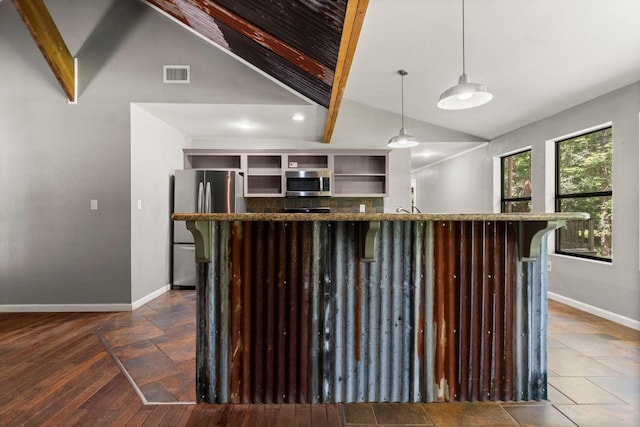 2540 Howell Rd, Corrigan, TX 75939 - kitchen with stainless steel appliances, vaulted ceiling, open shelves, a kitchen breakfast bar, and hanging light fixtures