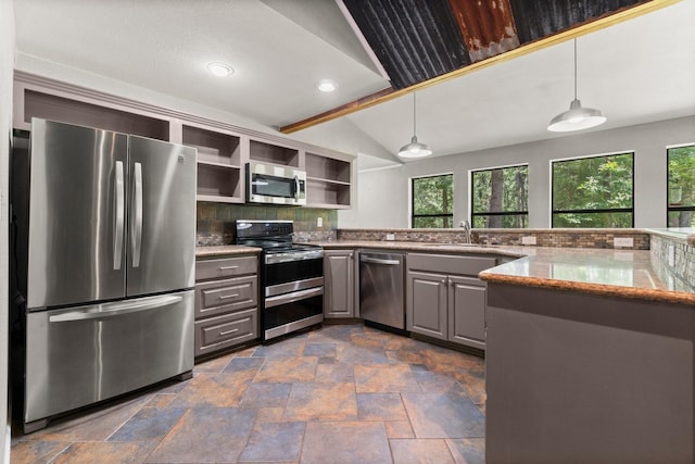 2540 Howell Rd, Corrigan, TX 75939 - kitchen with stainless steel appliances, open shelves, gray cabinetry, stone tile floors, and vaulted ceiling
