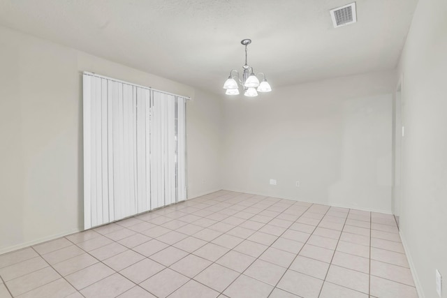 9403 Pinole Ln, Houston, TX 77086 - spare room featuring a chandelier and light tile patterned floors