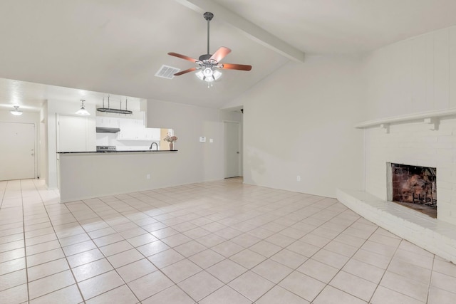 9403 Pinole Ln, Houston, TX 77086 - unfurnished living room featuring a ceiling fan, light tile patterned flooring, and a brick fireplace