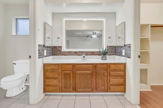 9403 Pinole Ln, Houston, TX 77086 - bathroom featuring vanity, tasteful backsplash, tile patterned flooring, and ceiling fan