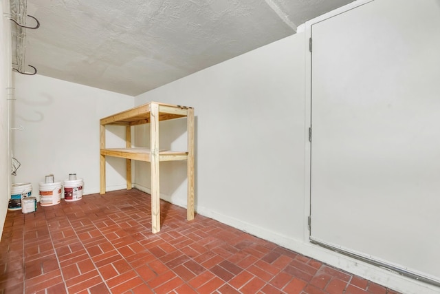 9403 Pinole Ln, Houston, TX 77086 - additional living space with brick patterned floors and baseboards