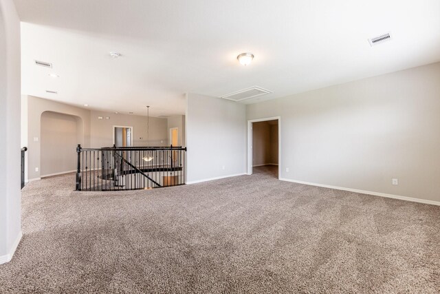 10318 Easterly Ln, Cypress, TX 77433 - carpeted empty room with arched walkways and attic access